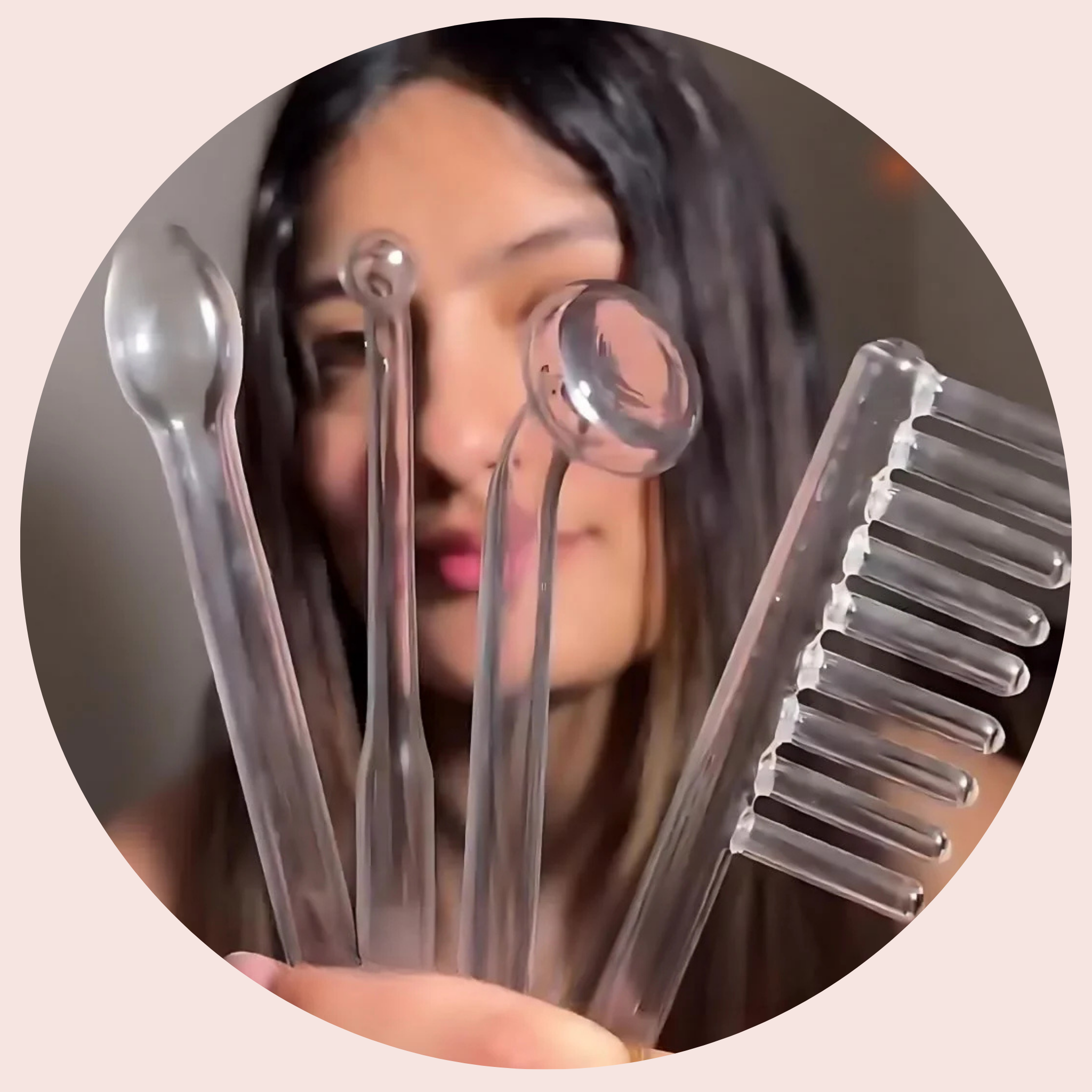 A woman holding the HairRevive Pro™ attachments for thicker hair